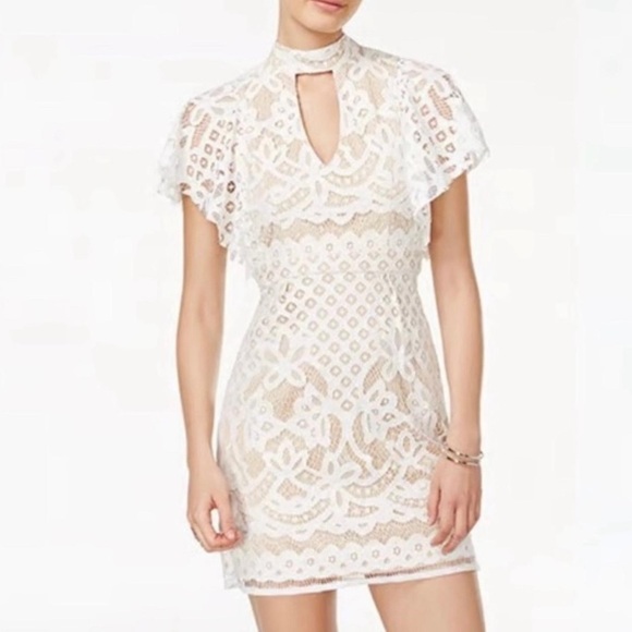 Crystal Doll Dresses & Skirts - Crystal Doll White Sheath Mini Dress with Ruffled Cut Outs